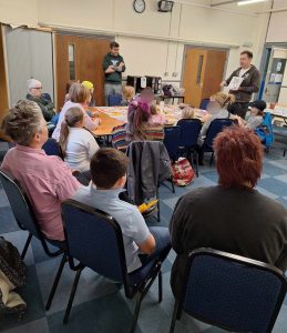 Troy Jenkinson reads his book to an audience of parents and children
