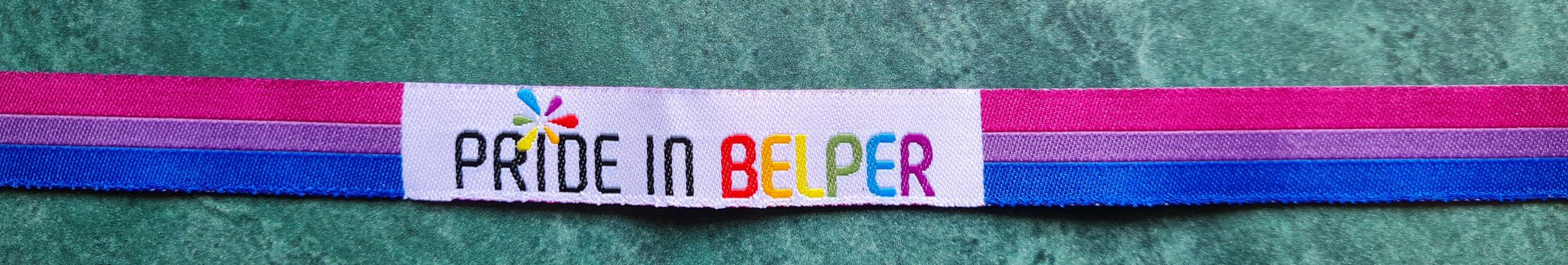 Pride in Belper 2025 wristband in the Bisexual colours